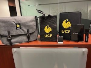 Photo of UCF laptop bag and padfolios.